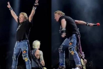 Axl Rose arremessa microfone para plateia e atinge f em show